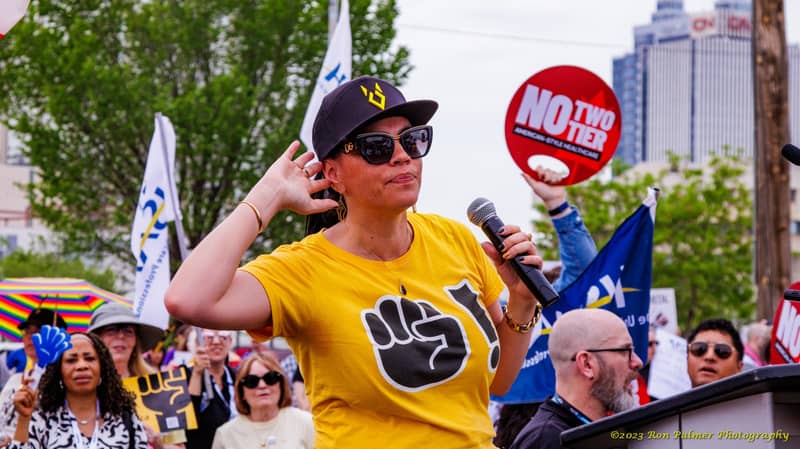 Speaker with a megaphone at the Calgary rally