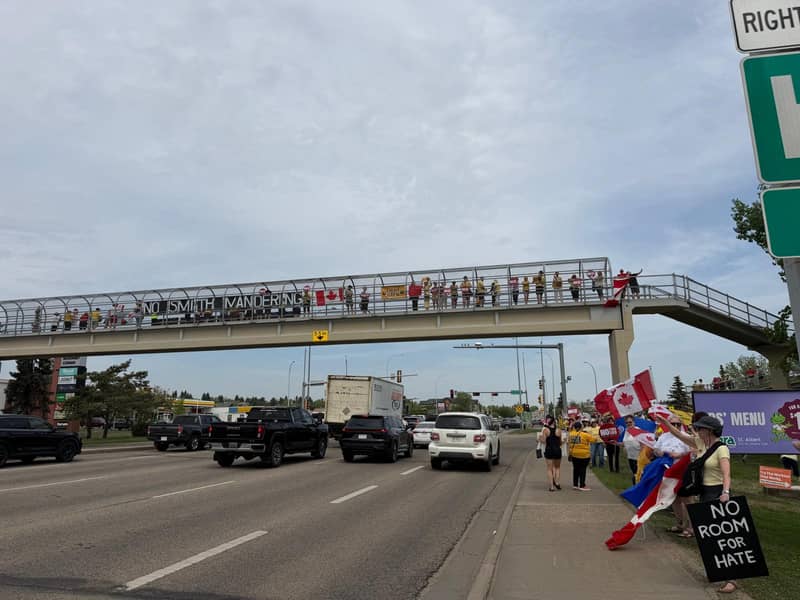 Supporters lining a highway overpass